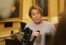 Gov. Maura Healey speaks to reporters at the State House